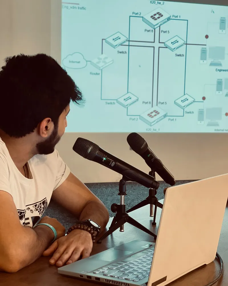 Ahmed presenting a FortiGate network diagram